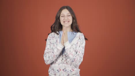 Young-woman-clapping-excitedly-to-camera.